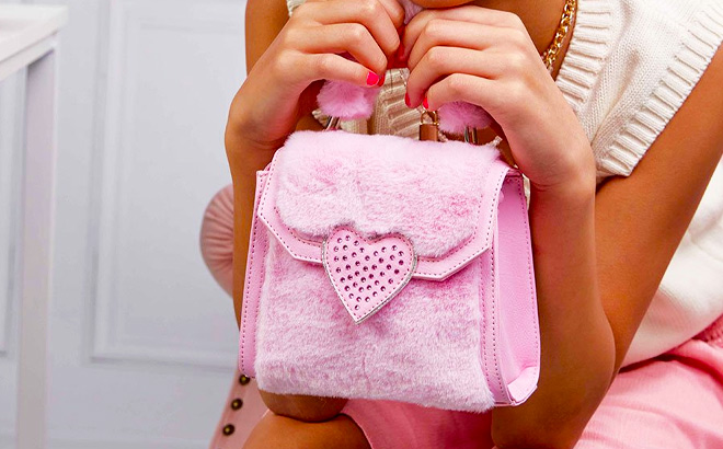 Girl is Holding a Pink Hearts Crossbody Bag