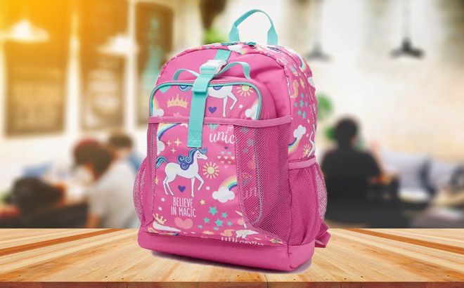 Girls Unicorn 2 in 1 Backpack set Backpack and Lunch Bag on a Wooden Table