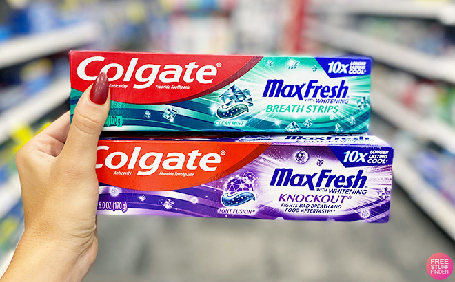 Hand Holding Colgate Max Fresh Toothpastes at CVS