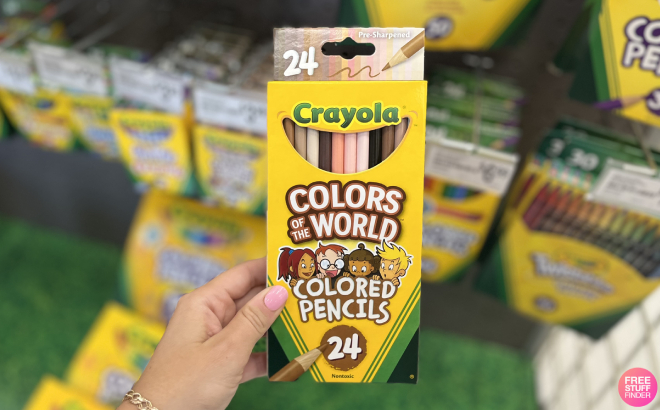 Hand Holding Crayola Colors of the Wrols Colored Pencils