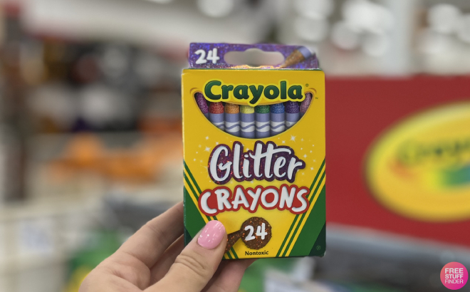 Hand Holding Crayola Glitter Crayons