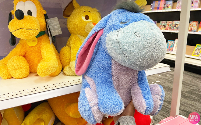 Hand Holding Eeyore Disney Weighted Plushie at Target