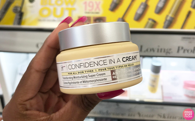 Hand Holding IT Cosmetics Confidence in a Cream Hydrating Moisturizer