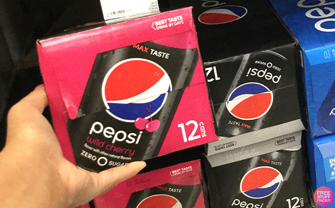 Hand Holding Pepsi Zero Soda Cans 12 Pack