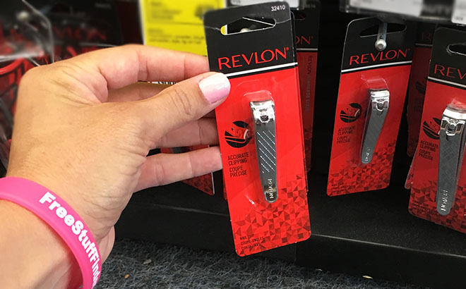 Hand Holding Revlon Nail Clipper