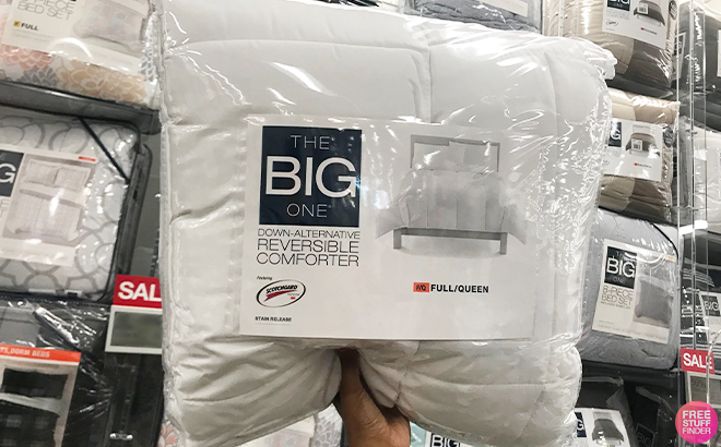 Hand Holding The Big One Down Alternative Reversible Comforter in White Hand Holding The Big One Down Alternative Reversible Comforter in White