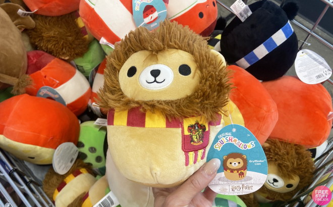 Hand Holding a Harry Potter Squishmallows Gryffindor Lion Plush Hand Holding a Harry Potter Squishmallows Gryffindor Lion Plush