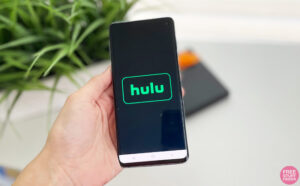 Hand Holding a Mobile Phone Showing Hulu App