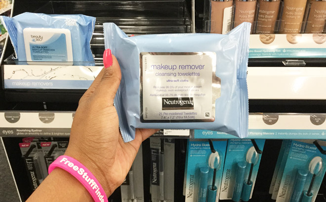 Hand Holding a Neutrogena Make Up Remover Wipes 21 Count