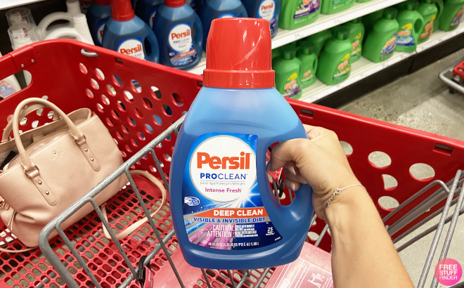 Hand Holding a Persil Intense Fresh Liquid Laundry Detergent