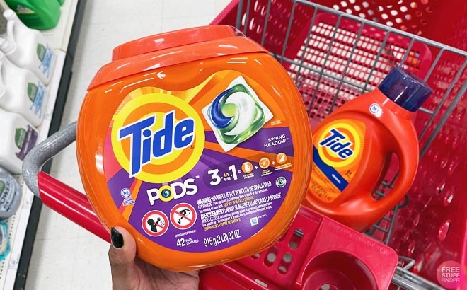 Hand Holding one Tide Power Pods 42 Count Hand Holding one Tide Power Pods 42 Count