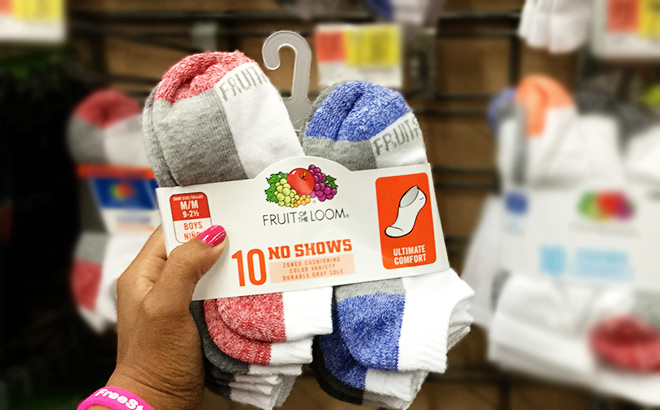 Hand holding a Fruit of the Loom boys socks 10 pack in a store aisle