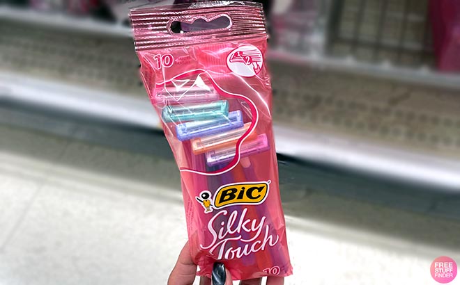 Hand holding one BIC Womens Disposable Razors