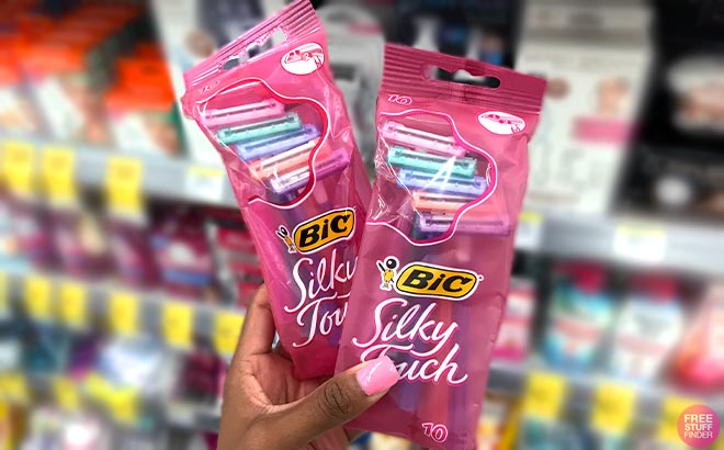 Hand holding two BIC Womens Disposable Razors