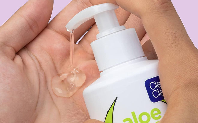 Hand using a Clean Clear Aloe Vera Acne Prone Gentle Cleanser