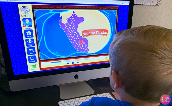 Kid Learning Geography on a Learning Program