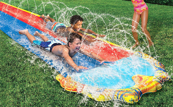 Kids Playing in Banzai Splash Sprint Racing Slide Kids Playing in Banzai Splash Sprint Racing Slide