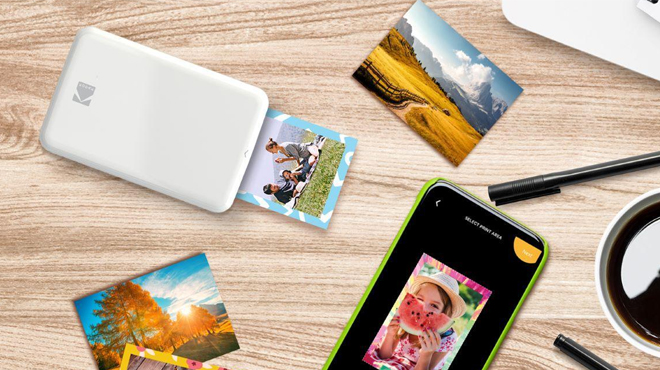 Kodak Step Wireless Photo Mini Printer printing some images from a mobile phone using bluetooth
