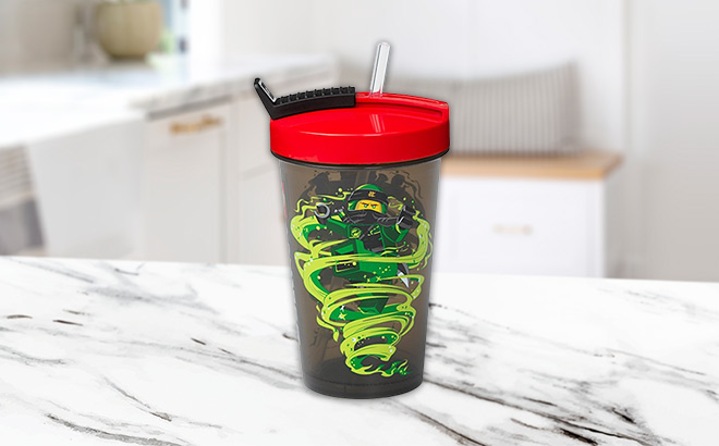 LEGO Ninjago Red Green Tumbler Straw on the kitchen table LEGO Ninjago Red Green Tumbler Straw on the kitchen table