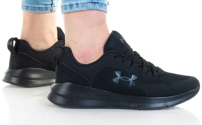 Man is Wearing a Under Armour Essential Sportstyle Shoes in Black color