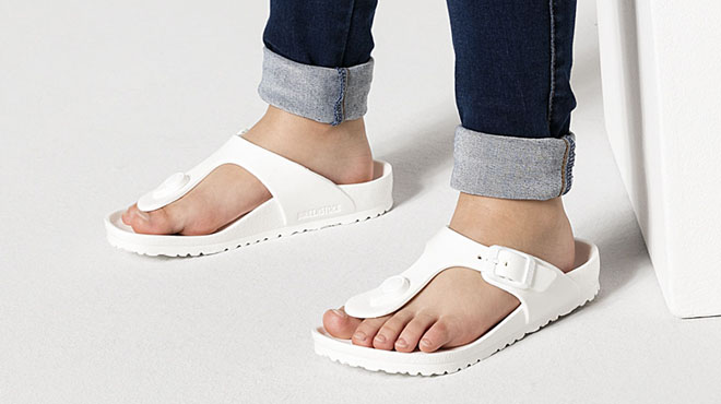 Person Wearing Birkenstock Gizeh Sandals in White Color