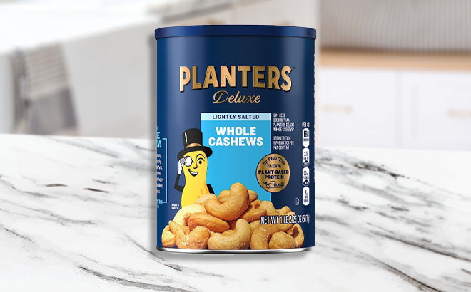 Planters Deluxe Lightly Salted Whole Cashews Plant Based Protein on a Counter