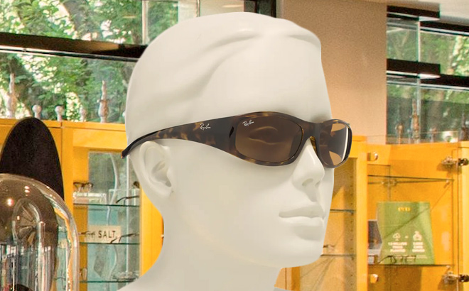 Ray Ban 57mm Rectangle Sunglasses on a Mannequin