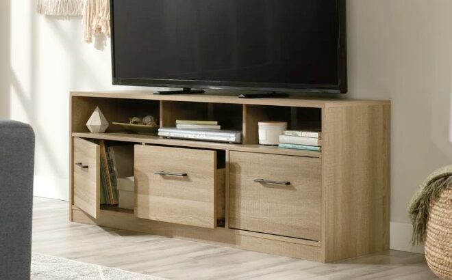 Sauder Beginnings TV Stand with Large Drawer 2 Storage Cabinets and Shelf for TVs up to 60 Summer Oak Finish