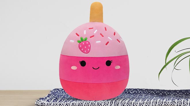 Squishmallows Pama the Pink Strawberry Cake Pop 11 Inch Plush on table