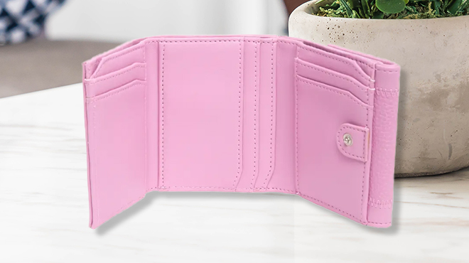 Steve Madden Bemily Trifold Wallet in Pink on a Table