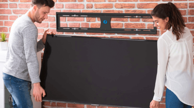 Two People Installing the Fixed TV Wall Mount Bracket