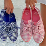 Two Person Carrying Two Different Colors of Sperry Womens Crest Vibe Gingham Sneakers