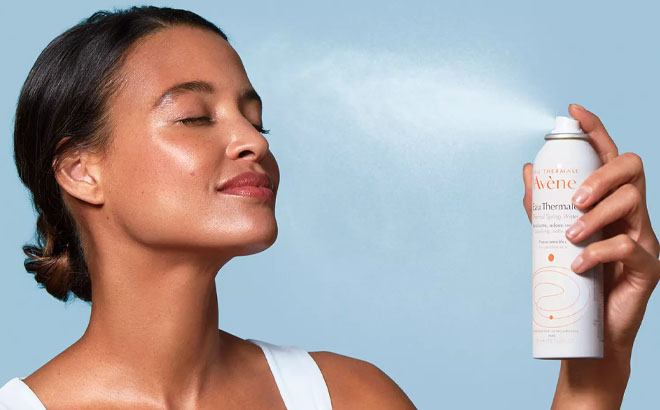 Woman Sprays Avene Thermal Spring Water on her Face
