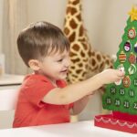 a Boy Playing with Melissa Doug Countdown to Christmas Wooden Advent Calendar