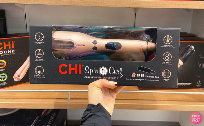 a Hand Holding Chi Ceramic Rotating Curler