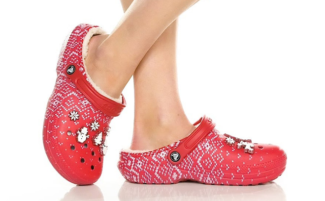a Pair of Crocs Classic Lined Holiday Charm Clogs