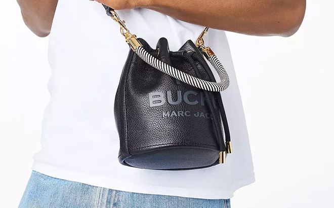 a Person with a Marc Jacobs Black The Leather Bucket Bag