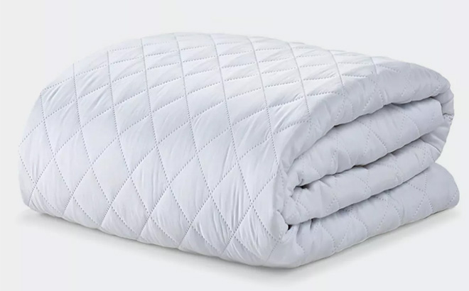 an Image of a Bed with Classic Quilted Mattress Protector