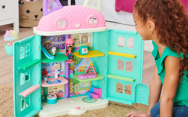 A Girl Playing with Her Gabbys Purrfect Dollhouse Playset