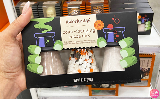 A Hand Holding Favorite Day Color Changing Cocoa Mix at Target