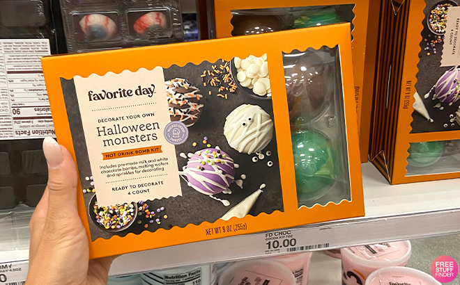 A Hand Holding Favorite Day Halloween DIY Cocoa Bomb Kit