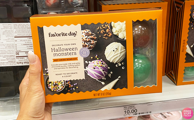 A Hand Holding Favorite Day Halloween Monsters Hot Drink Bomb Kit at Target