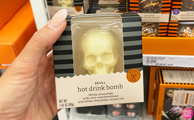 A Hand Holding Favorite Day Skull Hot Drink Bomb at Target