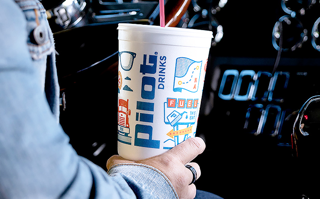 A Hand Holding a Drink from Pilot Flying J A Hand Holding a Drink from Pilot Flying J