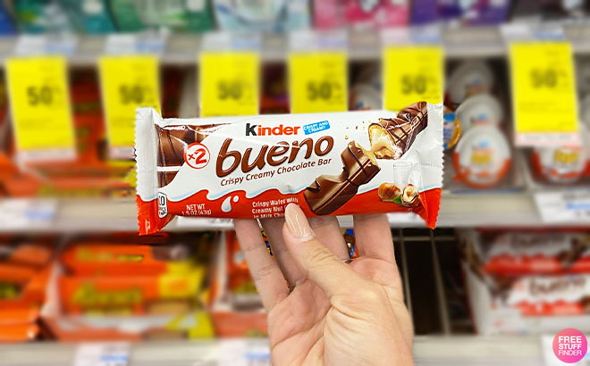 A Hand Holding a Kinder Bueno Bar A Hand Holding a Kinder Bueno Bar