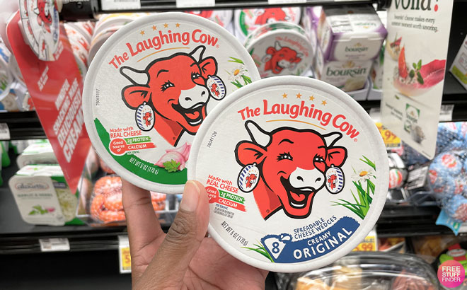 A Hand Holding a The Laughing Cow Cheese