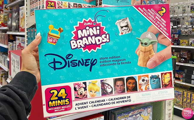 A Hand Holding the 5 Surprise Disney Mini Brands 2023 Advent Calendar at Target