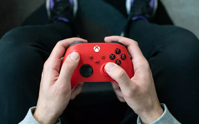 A Hond Holding a Xbox Series XS Wireless Controller A Hond Holding a Xbox Series XS Wireless Controller