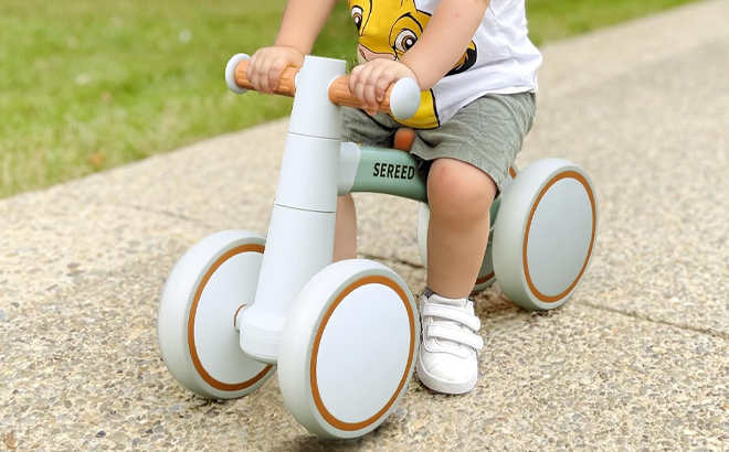 A Kid Riding a SEREED Baby Balance Bike