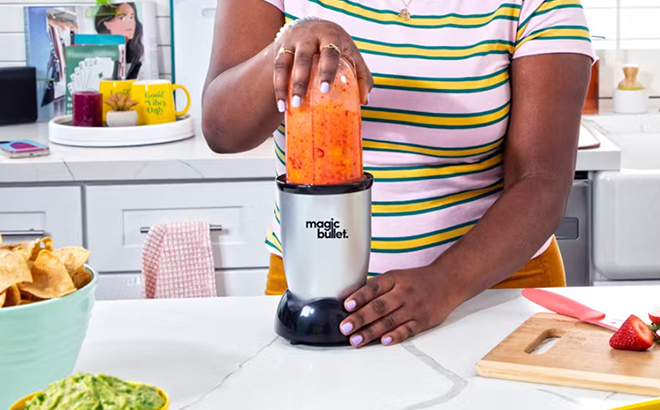 A Woman Using the Magic Bullet Single Serve Blender